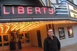 Rand Thornsley hopes more people will view movies at the Liberty Theatre, in downtown Camas. Thornsley, managing director of Rootstock Capital Management, LLC., signed a five-year lease on the theater in January 2011. Green lights have been added to the theater's entryway this month, to celebrate St. Patrick's Day. Anniversary festivities are scheduled for this week.