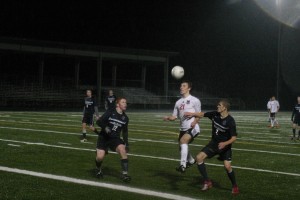 Nate Bealey (21) nudges the ball forward for Camas Monday, at Doc Harris Stadium. The Papermakers beat Skyview 2-1.