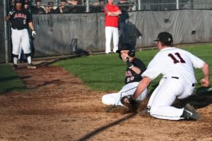 Tyce Funk slides home safe for the Camas baseball team Monday, at Union. The Papermakers defeated the Titans 9-6.