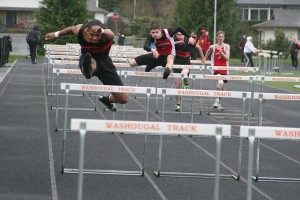 Joe Harris glides to first place in the 110-meter hurdles, with a time of 16.02 seconds, March 20, at Fishback Stadium. He also finished first in the discus (119 feet, 8 inches) and the triple jump (38-2.75), and second in the javelin (131-3).