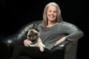 Judy Cusack, a certified interior custom designer, relaxes with her pug, Taxi. Cusack, of Washougal, recently received a "Best of Houzz" award for customer service. She is with Transitional Designs, LLC. "Taxi is always with me," Cusack said. "My clients get to know him, and some become new friends for him as well."