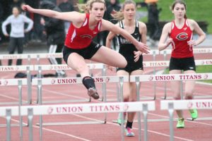 Jordan Davis flies over the hurdles for the Papermakers March 24, at Union High School. The senior set new school records in the 100 and 300 hurdles. On Saturday, she became the Tiger Invitational Female Athlete of the Meet.