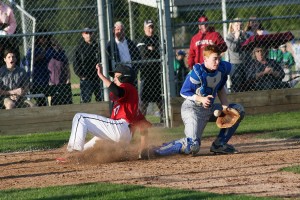 Sam Christopher slides into home plate and scores the tying run for the Camas baseball team in the bottom of the seventh inning Monday. Mountain View regained the lead in the eighth and won the game 7-6.