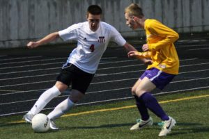 Camas forward Cayne Cardwell keeps the soccer ball alive for the Papermakers in the far right corner at Doc Harris Stadium. Camas defeated Columbia River 2-0 Wednesday.