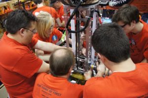 Contributed photo
Members and mentors of  Team 2471 "Team Mean Machine," a Camas based FIRST Robotics team, confer during the regional competition in Seattle. The team, which includes  students from Camas, Washougal and Hockinson high schools, took first in the three-day event and will be advancing to the world championships at the end of the month.