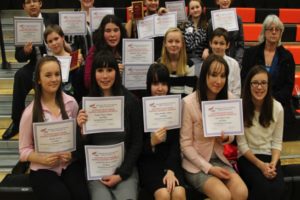 Jemtegaard Middle School FBLA members proudly show off their awards at the regional competition. With them is advisor Susan Nesmith.