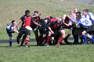 Jesse Saulo gets the kick off just in time for the Camas Rugby team Saturday, at Skyridge Middle School. The Mean Machine defeated Tualatin 50-3 to improve to 4-0 this season.