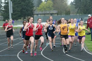 Camas runners Alexa Efraimson and Alissa Pudlitzke (left to right) stuck by each other in the 3,200-meter run during the John Ingram Twilight track and field meet Friday, at Columbia River High School. Pudlitzke won this race by setting a 16-second personal best time. Efraimson finished first in the 800 and helped the Camas girls win the 1,600 relay.