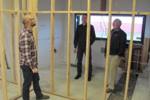 Brian Kashas, Chris Miller and Troy Hull look at the progress made so far on a renovation project involving the former First Independent Bank building in Camas. Hull and Travis Willis, with Earth Engineers, Inc., will relocate their company from Vancouver this summer. The former drive-thru area of the bank building will be enclosed to create a soils testing lab. Miller Kashas is the general contractor for the project.