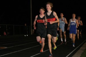 Washougal's Isaac Stinchfield (front) and Sean Eustis (left) push each other in the 3,200-meter run at the Kalama Invitational Friday. Eustis won this event with a time of 9:41.02. Stinchfield placed first in the 1,600 (4:28.46) and third in the 3,200 (9:54) with personal best times in both events.