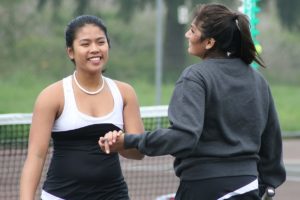 Hannah Giannan (left) and Meghal Sheth (right) celebrate a point April 21, in Camas.