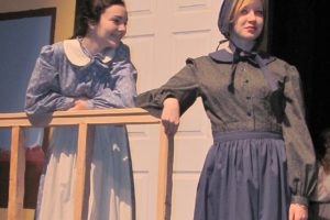 At right, Sarah Vonham (Robyn Pfeifer) shares a story with her daughter (Zoe West).  WHS drama students will perform "Quilters" the next two weekends at the Washburn Performing  Arts Center.