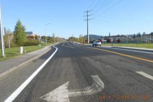 Thanks to a $6.3 million improvement project, Friberg-Strunk Street in Camas is now a three-lane paved road, with bike lanes, curbs and sidewalks on both sides,  and new signal lights.