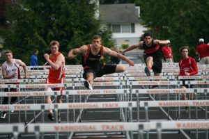 Hurdlers from Chehalis, Ridgefield Centralia, Washougal and White Salmon race to the finish line during the Panther Twilight track and field meet Friday, at Fishback Stadium.