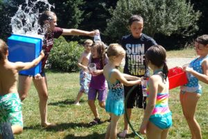 Attendees at "Ooey Gooey" at Camp Windy Hill  in Washougal enjoy a break to cool off during a hot summer day. There are several options for camps in the local area.