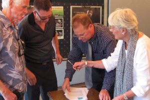 Rand Thornsley (second from left), managing director of The Rootstock Capital Management LLC, prepares to sign a five-year lease with Gary and Marilyn Webberley, owners of the Liberty building through Fourth Avenue Liberty LLC. Greg Goforth (second from right), a commercial real estate broker with Coldwell Banker Commercial, Jenkins & Associates, represented both parties. Thornsley plans to offer 3D presentations this summer and open an ice cream and sandwich shop next to the theater in July. He hopes to apply for a beer and wine license in June and start serving by Oct. 1. The May 7 lease signing ceremony was attended by several representatives of the Downtown Camas Association.