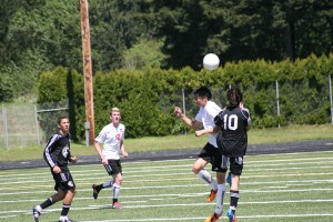 Roldan Alcobendas wins the battle in the air for the soccer ball Saturday, at Doc Harris Stadium. The junior from Camas fired in the winning goal in the final five minutes.