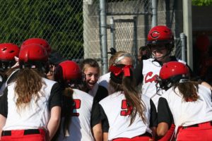 Alexis Tiedy meets her teammates at home plate after hitting a 3-run home run Thursday. The Camas High School softball team beat Battle Ground 2-1 Wednesday and Heritage 11-0 Thursday to become league champions.