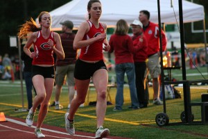 Camas Papermakers Alissa Pudlitzke and Emma Jenkins left the competition in the dust during the district 3,200-meter run Monday, at McKenzie Stadium.