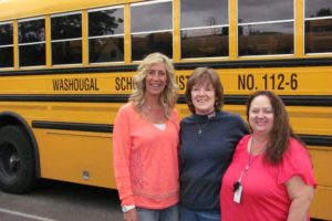 Washougal School District bus drivers, from left, Rachael Bentley, Charlie Dawson and Connie Allred credit a postive work environment as the reason for their longevity on the job. "You couldn't ask for a better group of people," Allred said.