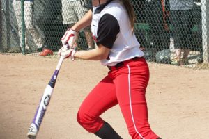 Maddie Neely delivers an RBI double in the first inning for the Papermakers, who beat Battle Ground 3-0 to become district champions Wednesday, at Battle Ground High School.