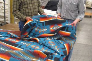 Charlie Bishop, left, vice president of mill operations at Pendleton Woolen Mill in Washougal, talks with Ted Prince, finishing supervisor. Prince has worked at the mill for 26 years. Pendleton has been named the Camas-Washougal Chamber of Commerce Business of the Year.