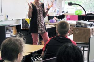 Author Elizabeth Rusch explains a writing activity to fourth-graders at Hathaway School Elementary during a workshop last Tuesday. Rusch, a children's author, also conducted two assemblies for students. Her visit was paid for by a grant from the Washougal Schools Foundation and Hathaway Boosters' funding.