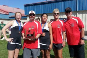 Camas tennis players Jen Lewis and Hannah Gianan share another doubles state championship with coaches Jonathan Burton, Annie Sumpter and Craig Sumpter Saturday, at the Columbia Basin Racquet Club, in Richland.