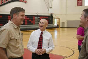 Former colleagues and friends share laughs with Charlie Hinds (center) during a community gathering event Saturday, at Liberty Middle School. On May 19, the former Camas High School teacher and wrestling coach was inducted into the Washington Chapter of the National Wrestling Hall of Fame.