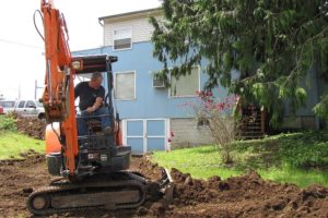 Myron Colvin is among the Camas Moose Lodge 1042 members volunteering to prepare the former Showboat Pub & Grill site for the lodge to relocate in mid-July. Excavator Rental Services, of Camas and Washougal, has donated the use of a mini excavator, to assist in the process.