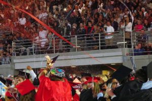 A chaotic and colorful scene breaks out at Doc Harris Stadium after all the graduating Camas High School seniors received their diplomas Friday.