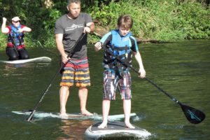 Terry Click encourages Ian Brown to paddle left and right during Friday's clinic on Lacamas Lake.