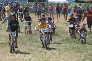 Parents, family members and spectators watch children take off on their bikes during Sunday's Race for the Future student mountain biking fundraising event, at Washougal Motocross Park.