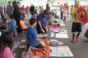 Students sell and buy items during Ancient Market Day, a lively event at Liberty Middle School. The purpose is to give them a hands-on experience in trade and economics.