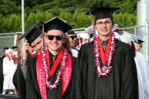 Camas High School senior class president Derek Hood and his friends are all smiles before graduation ceremonies began Friday night at Doc Harris Stadium.