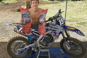 Alex Torres holds up his two tickets to the Loretta Lynn Nationals, which he earned June 7 at Washougal Motocross Park.