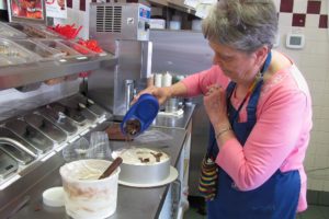 Wilma "Willi" McOmie makes an ice cream cake at the Dairy Queen in Camas. She and her husband David have owned the local franchise for 33 years. "I love it here, the community and the little kids," Willi said. "I can't imagine staying home."