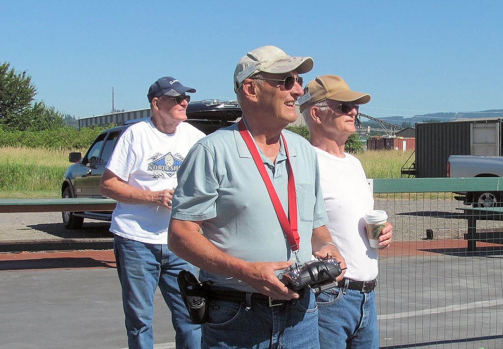 Joiner (front), Brewster (left) and Bob Greenwood enjoy the camaraderie and experience of flying model airplanes with the Fern Prairie Modelers club.
