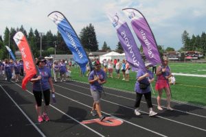 The Relay for Life of East Clark County began Saturday morning, with a walk around the track by cancer survivors and caregivers. The 24-hour event was held at Fishback Stadium, by Washougal High School.