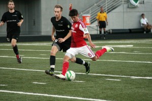 Jose Ribas (right) blisters the soccer ball for the Portland Timbers U-23 team Friday, at Doc Harris Stadium. Ribas and Zack Foxhoven scored goals for the Timbers, but Washington Crossfire won the game 3-2.