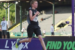 Sam Geiger sprints to the finish line at the Track Town Youth League Championships June 27, at Hayward Field in Eugene. The 12-year-old from Camas won the boys 11-12 1,500-meter run with a time of 5:05.19.