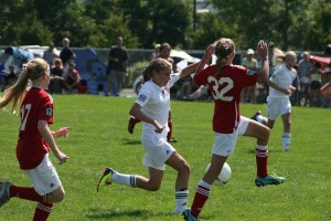 Perri Belzer (left) of the Vancouver Timbers 99 Red takes on a defender from the Camas-Washougal Soccer Alliance Valencia in the U-13 Platinum championship game of the Clash at the Border tournament. The Timbers beat Valencia 2-0.