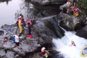 Emergency rescue crews, including the Clark County Technical Rescue Team, work to pull 19-year-old John Napierkowski from the Upper Washougal River Monday night. The Washougal resident was in the water for approximately 1 hour before being rescued. He was treated for hypothermia and minor injuries.