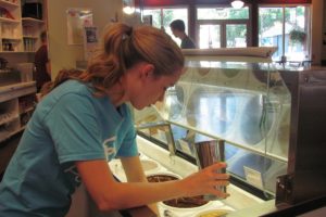 Photos by Danielle Frost/Post-Record
Lacey Little prepares a treat for a customer at Papa's Ice Cream in Washougal. She attends the University of Oregon and works at the store during school breaks and summer vacations.