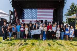 A local resident was among the 10 finalists for the Sing Fourth contest at the Fort Vancouver July 4th celebration. Nick Stevens of Washougal High School (12th from left) joined the nine other finalists for a group shot with the judges and mentors at the contest.