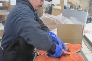 A Foods in Season employee packs King salmon from the Columbia River. Halibut, caviar, chanterelle mushrooms and truffle oil are among the items shipped from Building 15, in the Steigerwald Commerce Center, to restaurants throughout the U.S. The Port of Camas-Washougal and Foods in Season will be among the honorees at a "Top Projects" reception Wednesday.