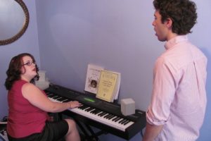 Anne Maguire listens as Liam Tully works on breath control exercises at her office in downtown Camas. She graduated from The Boston Conservatory in May 2012. Maguire provides private voice and music theory lessons for students ages 14 and older.