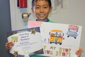 Kandai Shimada's poster promoting school bus saftey won a statewide contest, and will be judged at the national level in October.