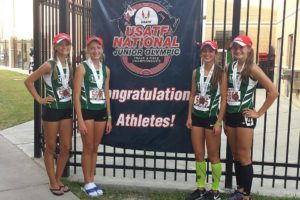 Evergreen Storm Track Club runners Emily Wilson, Brooklyn Jackson, Kaylee Merritt and Presley Timmons (left to right) show off their third-place medals from 3,200-meter relay race July 23, at the National Junior Olympic Championships, in Humble, Texas.