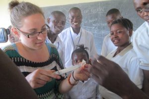 Webberly conducts a lab practical with two of her classes after teaching them the nervous system. She is serving as a volunteer teacher in Sierra Leone.